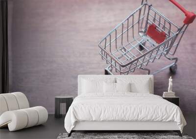 Empty shopping cart on wooden copy space Wall mural