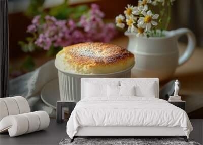 A Creamy Custard Dessert with Powdered Sugar, Served on a White Saucer with a Silver Spoon Wall mural