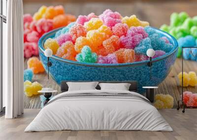 Colorful Sugar-Coated Candies in Blue Bowl on Wooden Surface Wall mural