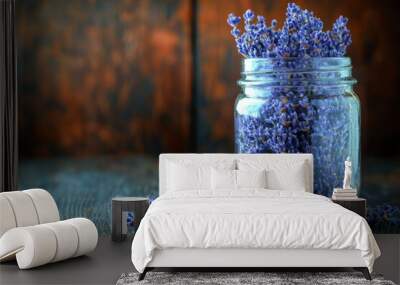 Dried lavender flowers in a glass jar on a wooden surface Wall mural