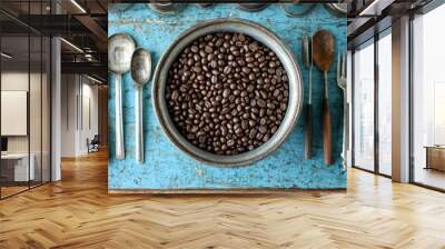 Metal Bowl Filled with Roasted Coffee Beans on a Distressed Blue Wooden Surface Wall mural