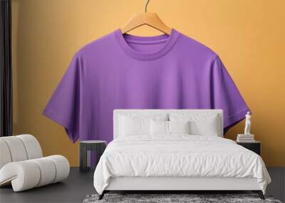 Purple T-shirt Hanging on Wooden Hanger Against Yellow Background Wall mural