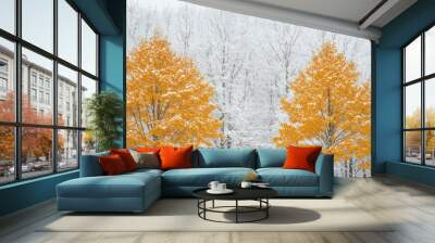 Two Golden Trees Against a Snowy Forest Background Wall mural