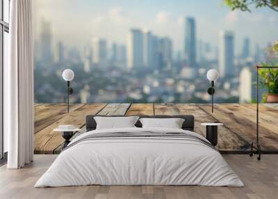 The empty wooden table top with blur background of sky lounge on rooftop with cityscape view Wall mural