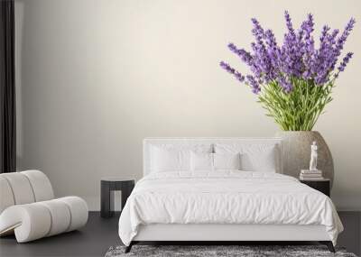 Lavender bouquet in a stone vase, white isolated background Wall mural