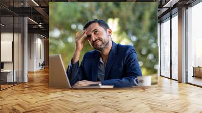 a mature business man in an outdoor ambition working ,blue coat suit,multiracial armenian,annoying coworker Wall mural