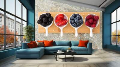 Assorted fresh berries in taster dishes Wall mural