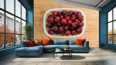 punnet filled with ripe red summer cherries Wall mural