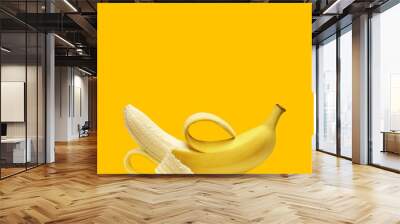 Peeled banana isolated on white background Wall mural