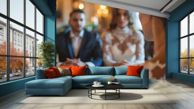 A woman is sitting at a table with two men, one of whom is a groom Wall mural