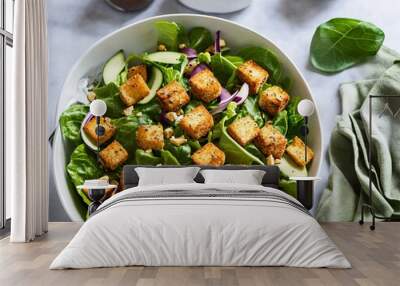 salad with cruton, fresh vegetables and feta cheese on white plate on a light background. top view. Wall mural