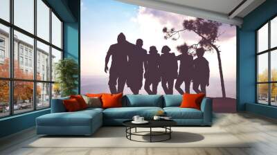 group of people or family or friend on a hill in silhouette style or shadow. Wall mural