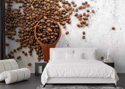 roasted coffee bean in wooden spoon on white background. Wall mural