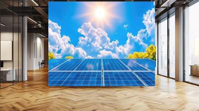 Solar panels harnessing sunlight under vibrant blue sky with fluffy clouds and trees Wall mural