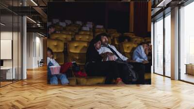 Young and adult audience scared and horror with watching movies in cinema. Wall mural