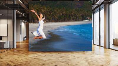 young girl on tropical island beach Wall mural