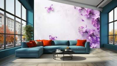 A beautiful bouquet of purple flowers with butterflies on a white marble background. Wall mural