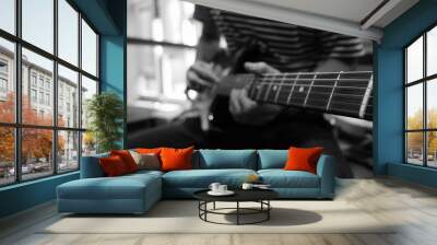 Blured Photo of young musician playing Electric Guitar, play the music instruments, black and white tone Wall mural