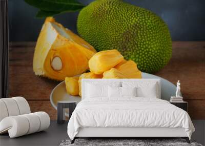 Ripe jackfruit flesh in a white plate on a wooden table for tropical fruit or meat substitute concept. Wall mural