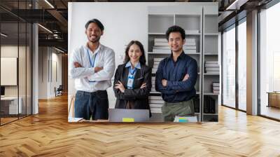 Confident business team standing in the office Wall mural