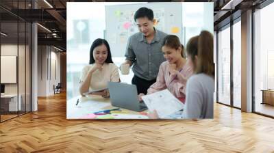 Group of asian creative teamwork discuss at business meeting for developing mobile phone app project, ux, ui start up, small business concept Wall mural