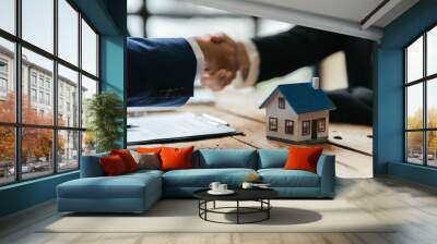 Real estate broker and customer shaking hands after signing a contract: real estate, home loan and insurance concept Wall mural