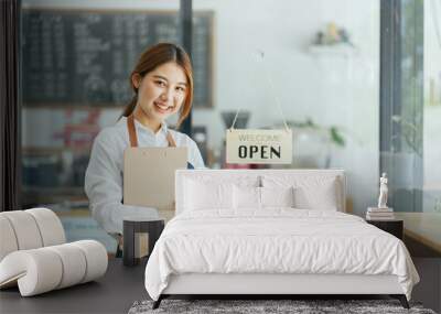 Smiling waitress or cafe business owner entrepreneur looking at camera Wall mural