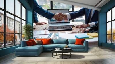 Young business people shaking hands in the office. Finishing successful meeting. Three persons Wall mural