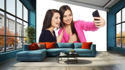 two girls friends taking selfie with smartphone Wall mural