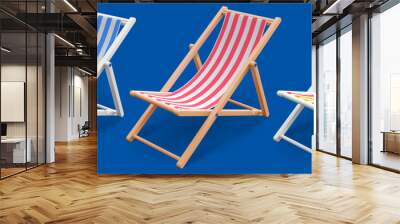 Beach chair 3d realistic. Set of isolated wooden, striped deck chairs or beach loungers with blue, red and multicolor stripes. Vector illustration. Wall mural