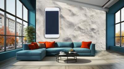 Smartphone on the sand Wall mural