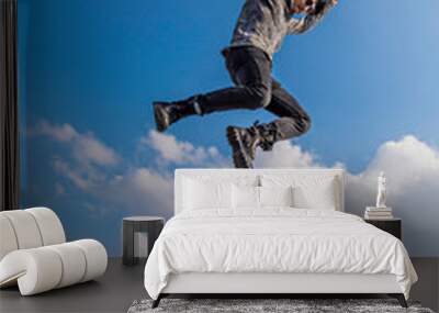 man jumping on the mountain Wall mural