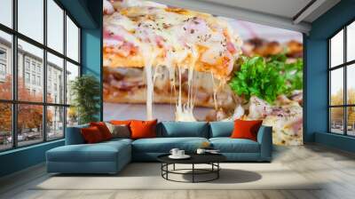 Family lunch eating pizza ham cheese recipe - people with favour italian dish concept Wall mural