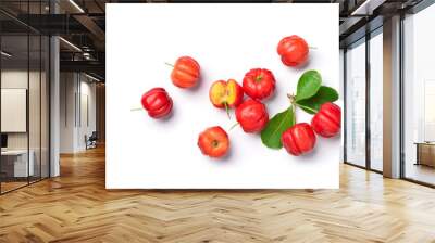 Flat lay of Acerola cherry with cut in half and leaves on white background. Wall mural