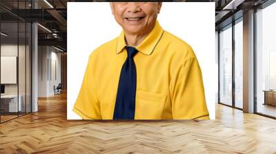 Mature Philippine man in a yellow uniform with a blue tie, smiling and looking professional and confident. Wall mural