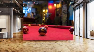 Pool table with several scattered balls. You can see ball 12 and 15. In the background you see people having drinks in what looks like a bar Wall mural