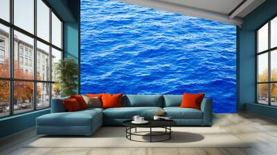 Blue water with sun reflections. Sea background Wall mural