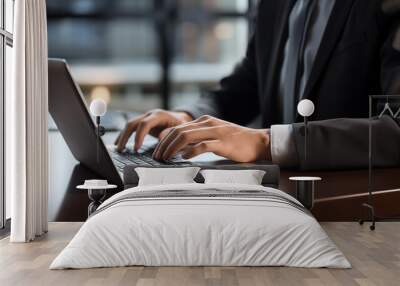 close-up of male hands of businessman pressing on laptop keyboard freelancer technology finance and business Wall mural