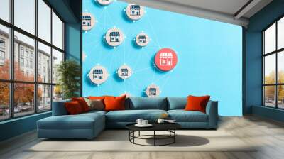 Franchise business concept. wooden blocks with network of connected store icons for franchise business e-commerce online e-marketplace and digital marketing branch expansion. Wall mural