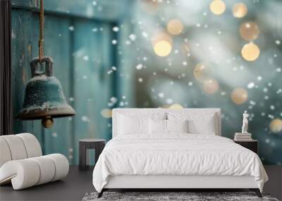 A rustic bell hanging from an old wooden wall with snow falling and bokeh lights in the background, evoking a festive winter atmosphere. Wall mural