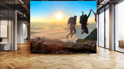 Group of happy hiker jumping on the hill Wall mural