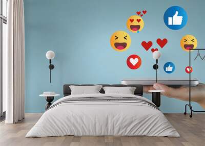 Social media,Social network,communication concept.,Hand sign posture ignore with smartphone on blue background with social media emoticons. Wall mural