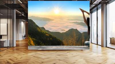 Young woman practicing yoga in the nature Wall mural