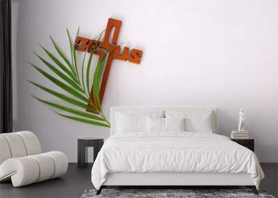 Cross and palm on white background with copyspace. Palm Sunday concept Wall mural