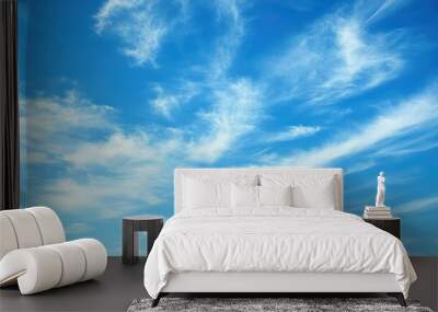 A clear blue sky with a gentle breeze, resembling the sky carefree nature Wall mural