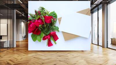 postcard mockup. small bouquet of red roses on a white background and place for text  Wall mural