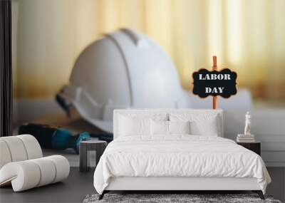 Labor Day text With a helmet and a screwdriver on the table. Wall mural