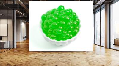 a bowl filled with popping boba on a white background Wall mural