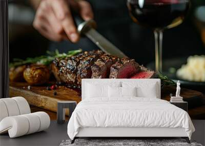 Sliced Rare Steak on a Wooden Cutting Board with Rosemary and Wine Wall mural