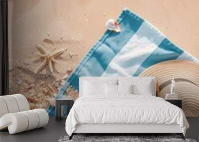 A top-down view of a sandy beach with seashells, a hat, and sunglasses, surrounded by gentle waves and sea foam. Perfect for summer and vacation themes, banners, text overlays, or travel inspiration. Wall mural